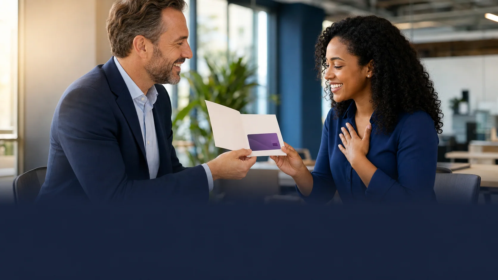 A manager sharing a reward card with an employee